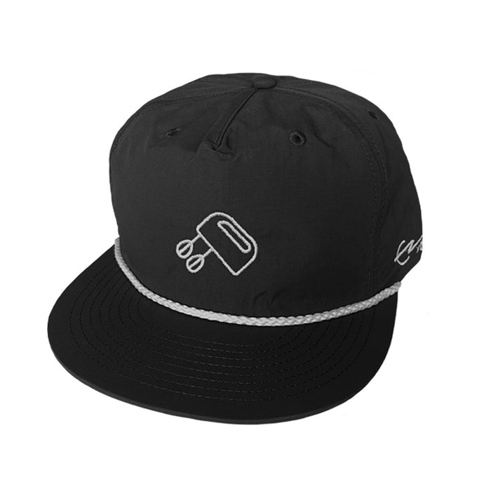 Black Rope Cap with white with Tjing Ambassador Elvis Eriksson Sveiven's personal logo embroidery on the front panel and signature on the side rim. Single panel at front, quick dry fabric, plastic snapback, tonal under-peak lining - one size fits all.